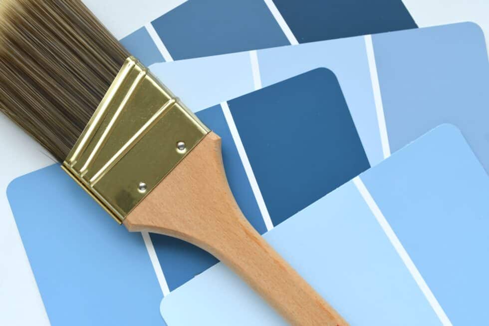A brush on top of several blue color palette guides.
